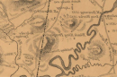 图片显示浅棕色背景和灰色地图文本，上面标有黑色国王庞贝